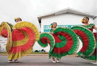  ?? Melissa Phillip / Staff photograph­er ?? Members of Ballet Folklorico México Vivo perform during the I Love Fifth Ward Block Party Saturday held outside the Louis White Building, 4101 Lyons Ave.