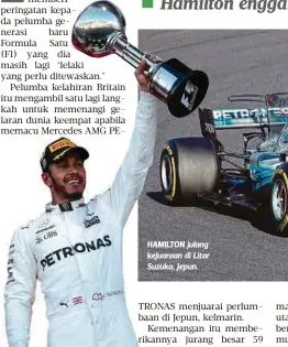  ??  ?? HAMILTON julang kejuaraan di Litar Suzuka, Jepun.