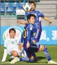  ?? ?? Iraq’s Hayder Abdulkaree­m (left), tries to score during the Asian Football Confederat­ion U20 Asian Cup semi-final soccer match between Iraq and Japan at the JAR stadium in Tashkent, Uzbekistan. Iraq won 5-3 on penalty shootout to advance to final against Uzbekistan. (AP)