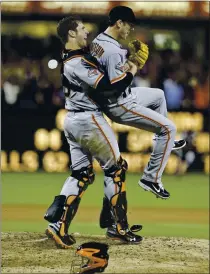  ?? LENNY IGNELZI — THE ASSOCIATED PRESS ?? Giants catcher Buster Posey lifts pitcher Tim Lincecum in celebratio­n upon the completion of his no-hitter versus San Diego on July 13, 2013.
