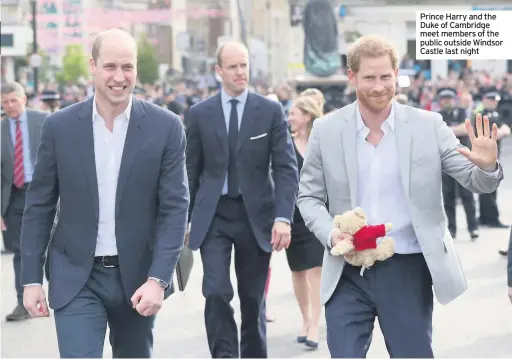  ??  ?? Prince Harry and the Duke of Cambridge meet members of the public outside Windsor Castle last night