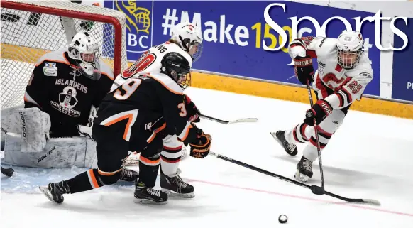  ?? CITIZEN PHOTO BY BRENT BRAATEN ?? Cariboo Cougars player Hunter Floris takes a shot off a rebound from behind the Cape Breton West Islanders’ during the first period of their round robin game in CN Centre on Wednesday, during the 2017 Telus Cup.