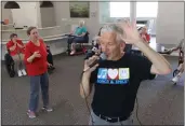  ?? REBECCA SLEZAK — THE DALLAS MORNING NEWS ?? Susan Norris dances as Eric Kolb, a founder of the nonprofit Songs&Smiles, spins while singing with residents on Tuesday at Villagio of Carrollton in Carrollton, Texas. Those in attendance danced and sang along to popular 1960s-era songs. Kolb has visited the residents to sing twice a month over the last year