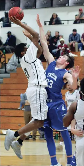  ??  ?? Ridgeland’s Christian Battle goes up for a shot over Trion’s Jarrett Gill during Saturday’s clash in Rossville. The Panthers held on for a 61-59 win in the nonregion game. (Messenger photo/Scott Herpst) Ridgeland boys 67, Pickens 63 LaFayette boys 54,...