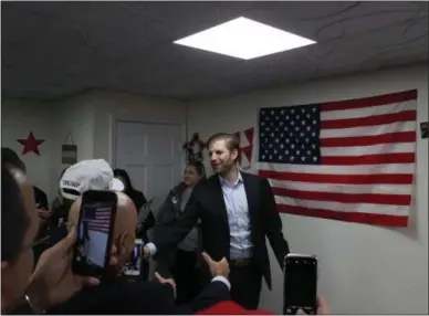  ?? CHARLES PRITCHARD - ONEIDA DAILY DISPATCH ?? Eric Trump shakes hands with supporters in New Hartford on Tuesday, Oct. 23, 2018.