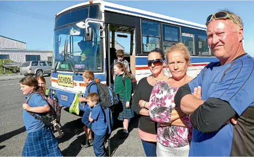  ?? JOHN HAWKINS/FAIRFAX NZ 633959314 ?? Wendy Kennedy, Gayleen Rawlings and Alastair McCracken outside the current Orepuki bus stop.