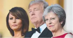  ??  ?? US First Lady Melania Trump, President Donald Trump and British Prime Minister Theresa May at a black-tie dinner in London.