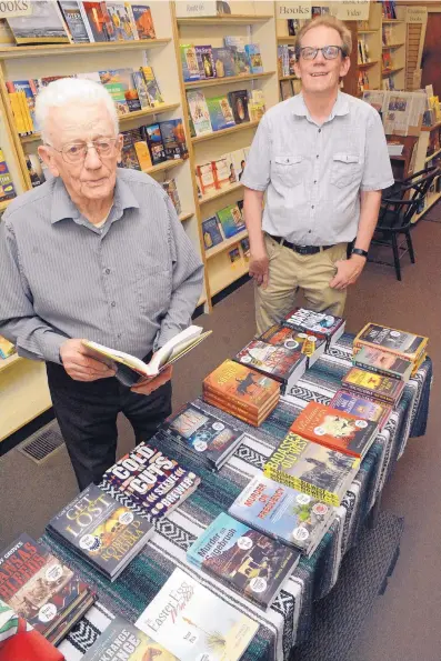  ?? JIM THOMPSON/JOURNAL ?? James Hoffsis, left, and his son, John, at the Treasure House Books & Gifts in Old Town, which has been rated one of the world’s best independen­t bookstores.