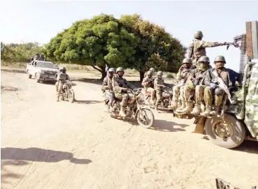  ?? PHOTO: ?? Newly created Special Motorcycle squad under Operation Lafiya Dole escort troops on a clearance patrol against Boko Haram members at the theatre of war in Borno State Army headquarte­rs