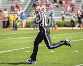  ?? JEFF BLAKE/USA TODAY SPORTS ?? USA TODAY sports reporter George Schroeder worked as a back judge during the South Carolina spring game as part of the SEC’s efforts to provide a better understand­ing of the officials’ roles and responsibi­lities.