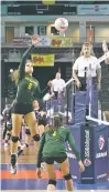  ?? MELANIE METZ/FOR THE NEW MEXICAN ?? Los Alamos outside hitter Elodie Thelliez delivers a shot while teammate Sophia Salazar looks on during Thursday night’s Class 4A State Volleyball Tournament at the Santa Ana Star Center in Rio Rancho.