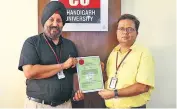  ??  ?? Dr. Satbir Sehgal, Dean Research and Dr. Manish Goswami, Principal,UIPS showing the Certificat­ion of Award for the patents filed in the field of Bio-Technology and Pharmacy by the Core Research Group of Chandigarh University Gharuan.