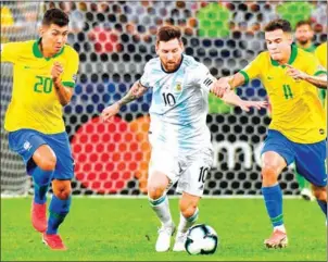  ?? NELSON ALMEIDA/AFP ?? Lionel Messi is marked by Roberto Firmino and Philippe Coutinho during the Copa America semi-final at the Mineirao Stadium in Belo Horizonte, Brazil, on Tuesday.