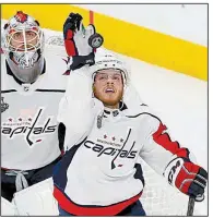  ?? AP/ROSS D. FRANKLIN ?? Washington Capitals defenseman John Carlson knocks the puck away in the closing seconds of the Capitals’ victory over the Vegas Golden Knights in Game 2 of the Stanley Cup Final on Wednesday night in Las Vegas.