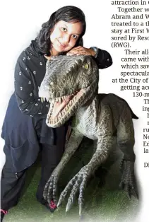  ??  ?? Jasvina J is brave indeed as a she hugs a life-size dinosaur model at the Jurassic Research Centre.
