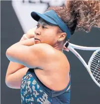  ?? DAVID GRAY AFP VIA GETTY IMAGES ?? Japan’s Naomi Osaka hits a return against Spain’s Garbine Muguruza on Sunday at the Australian Open in Melbourne.