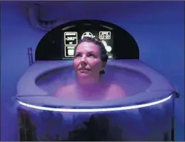  ?? Mel Melcon Los Angeles Times ?? LANI COOPER, 38, undergoes whole-body cryotherap­y at Coast Cryo on the Westside. The treatment is among the recovery strategies gaining popularity.