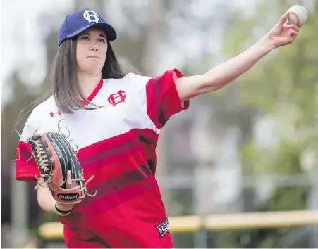  ??  ?? Southpaw spinmaster Claire Eccles demonstrat­es her knucklebal­l at Royal Athletic Park on Tuesday. The 19-year-old from White Rock joins the Victoria HarbourCat­s on June 6 for a home date against the Wenatchee AppleSox.