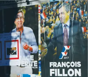  ??  ?? CAMPAIGN POSTERS of François Fillon.