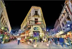  ?? Rick Steves’ Europe/CAMERON HEWITT ?? Bucharest’s Old Town after dark has a vibrant party vibe.