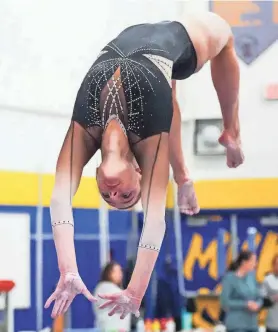  ?? SCOTT ASH / NOW NEWS GROUP ?? Franklin/Muskego’s Kaylee Stoeger competes on the beam on her way to winning the all-around at the Mukwonago sectional.