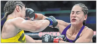  ?? David Dermer The Associated Press ?? Las Vegan Jessica Eye, right, fighting Brazil’s Bethe Correia in a 2016 loss, will face Jennifer Maia in a flyweight bout at UFC 264 in July at T-mobile Arena.