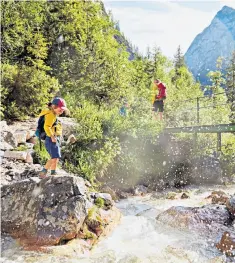  ??  ?? gFamily fun at Zugspitze, Germany’s highest peak, the starting point for a bike ride to Lake
Garda in Italy