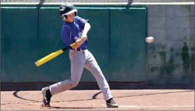  ?? PHOTOS BY MIKE BUSH/NEWS-SENTINEL ?? Above: Lodi batter Matt Gobel gets ready to smack the basebal over the left field fence for a home run in Saturday's Cal Ripken 11U All-Star Tournament at Salas Park. Below: Lodi pitcher Carson Devine throws a pitch toward home plate.