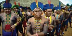  ??  ?? In this file photo members of the Tapirape tribe wait to perform a ceremonial dance for indigenous leader Cacique Raoni Metuktire (out of frame), of the Kayapo tribe, in Piaracu, a village near Sao Jose do Xingu, Mato Grosso State, Brazil.