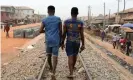  ?? ?? A Nigerian man, one of 47 charged with a ‘public display of affection with members of the same sex’, with a friend in Lagos. With its love stories from African countries, the podcast AfroQueer has brought LGBTQ+ people together. Photograph: Temilade Adelaja/Reuters