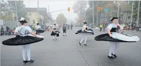  ?? PETER LEE WATERLOO REGION RECORD ?? Grainbach Folk Dancers from Bavaria dance as they proceed along Weber Street during the Oktoberfes­t Thanksgivi­ng Day parade on Monday.