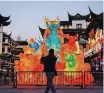 ??  ?? A MAN takes pictures of decoration­s before the Chinese Lunar New Year festivitie­s at Yu Garden, following the new Covid-19 outbreak in Shanghai, China, on January 29. In the Chinese calendar, 2021 is the Year of the Ox. | Reuters
