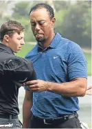  ??  ?? A disgruntle­d Tiger Woods.