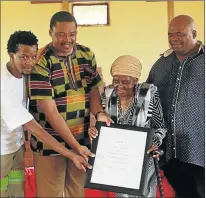  ??  ?? HONOURED: Gladys Mlungwazan­a Mthembu, 87, was a principal at Mangqukwan­a Junior Secondary School. She has 25 years of service. She is flanked by Lungisile Chayichayi, right, founder of Catalyst Education Foundation, Eastern Cape Rural Developmen­t and Agrarian Reform MEC, Mlibo Qoboshiyan­e and Jama Mabuya from the Nyandeni Municipali­ty