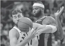  ?? NATHAN DENETTE/THE CANADIAN PRESS ?? Raptors centre Jonas Valanciuna­s and New Orleans Pelicans counterpar­t DeMarcus (Boogie) Cousins have never met, despite the number of times they have clashed on court.