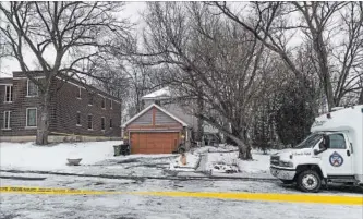  ?? AARON VINCENT ELKAIM NEW YORK TIMES ?? Police tape surrounds the property where Bruce McArthur had worked as a landscaper, and where police said they had recovered the dismembere­d remains of six people from planters, in Toronto, Feb. 1.