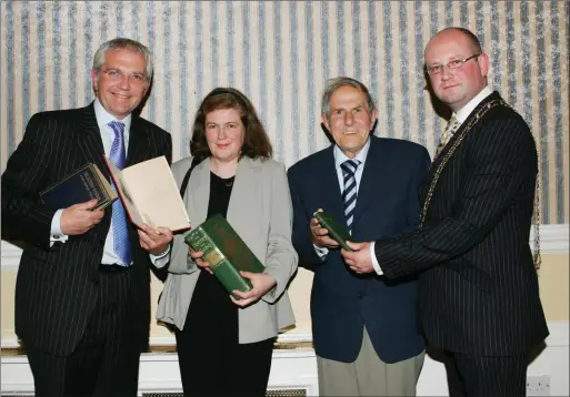  ??  ?? Paul Allen of Allen Associates Presenting Librarian Anne Keavney of the Drogheda Library with the Rare Books By John Boyle O Reilly with Chris Allen and the Mayor Ged Nash in The Europa Hotel