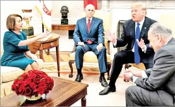  ?? — AFP photo ?? In this file photo shows US vice-president Mike Pence (second left) listens while Pelosi (left), Trump (second right) and Democratic Senate Minority Leader Charles Schumer argue about the impending government shutdown during a meeting at the White House in Washington, DC.