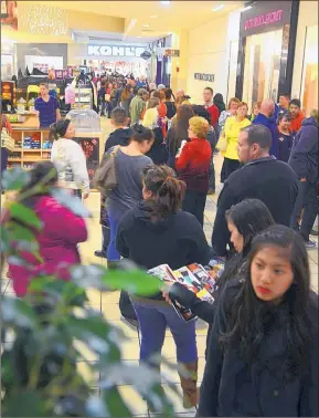  ?? JOURNAL FILE ?? Thehe B Black Friday rush at Coronado Center began on Thanksgivi­ng evening in 2013. Selec Select mall stores will open at 6 p.m. Thursday this year.