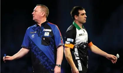  ?? ?? Glen Durrant (left) was outplayed by William O’Connor in their second-round match at Alexandra Palace. Photograph: Zac Goodwin/PA