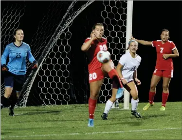  ?? PILOT PHOTOS/RUDY MARQUEZ ?? ABOVE: Lexi Rose (20) clears the ball out of the box. Also in the picture for Plymouth are Mia Wojcik and Claudia Marohn (7); for the Academy (16) Mallary Magee.