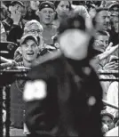  ?? ROB CARR/GETTY ?? Nationals fans give an earful to home plate umpire Lance Barksdale during Game 5.