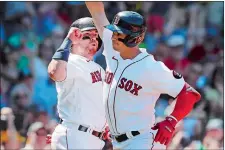  ?? MICHAEL DWYER/AP PHOTO ?? Bobby Dalbec of the Boston Red Sox, right, celebrates after his tworun home run that also drove in Christian Vazquez, left, during the second inning of Sunday’s game against the Baltimore Orioles.