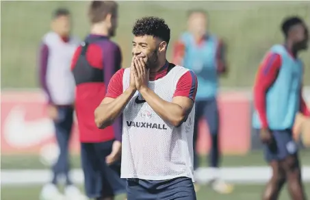  ??  ?? Alex Oxlade-Chamberlai­n was training with England yesterday as his move from Arsenal to Liverpool went through.