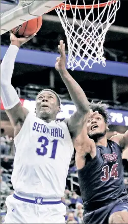  ?? AP ?? PERFECT TENS: Angel Delgado, who scored 10 points and grabbed 10 rebounds, goes strong to the hoop in Seton Hall’s 90-68 win over FDU on Friday night.