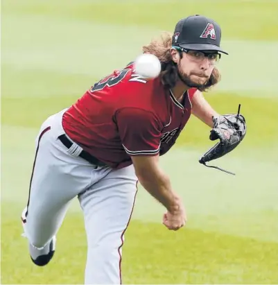  ?? RALPH FRESO/GETTY ?? Diamondbac­ks pitcher Zac Gallen throws prior to a spring training game against the Rockies on Feb. 28 in Scottsdale, Arizona.