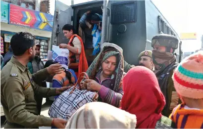  ?? AP ?? Police rescue civilians following shelling from the Pakistan side of the border, in Ranbir Singh Pura district of J&K, on Friday. —