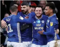  ??  ?? LEEWAY Cardiff City’s Lee Tomlin celebrates his winner