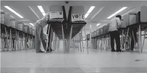  ??  ?? Voters cast ballots in 2016 at City Hall in San Francisco. The city will become the first in California and one of only a handful nationwide to allow noncitizen­s to vote in a local election in November. They’re only allowed to vote in the school board race.