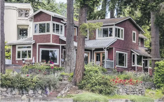  ??  ?? The Johnsons’ home on Bainbridge Island’s Eagle Harbor wasn’t much more than a cabin when it was built in 1920.